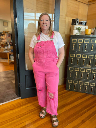 pink distressed overalls